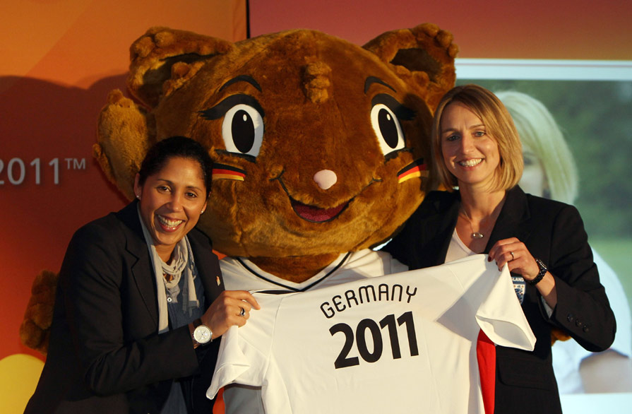 The FIFA Women's World Cup Local Organising Committee (LOC) President Steffi Jones (left) with Official Mascot Karla Kick and England captain Faye White.